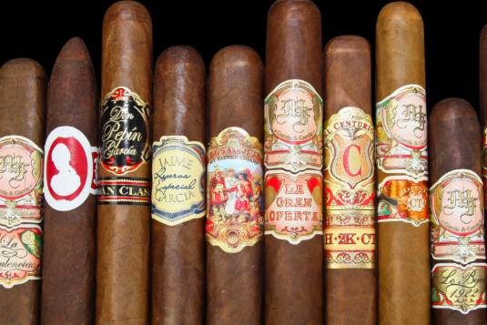 A row of cigars from different brands in various sizes